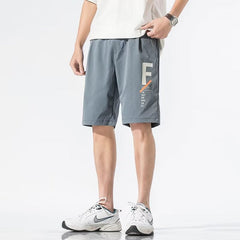 Shorts masculino verão solto estilo coreano calças esportivas da moda seção fina calça de cinco pontas de seda de gelo para combinar com praia