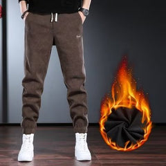 Calças masculinas de outono e inverno da marca da moda de lã de cor pura versão coreana das calças de pés pequenos calças slim fit
