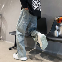 Calças jeans larga bordadas masculinas