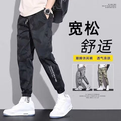Calças casuais masculinas primavera e outono nova juventude folgada ferramentas esportivas camuflagem longa