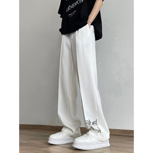 calça reta e larga estilo savana com folhas nas pontas