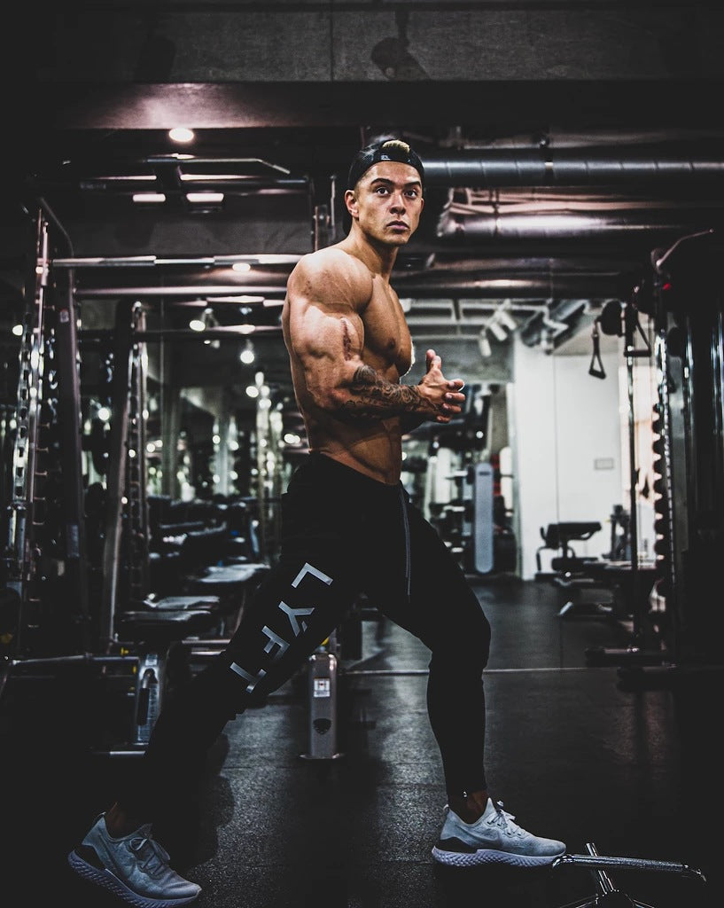 calça masculina de esportes estilo fino com bolsos
