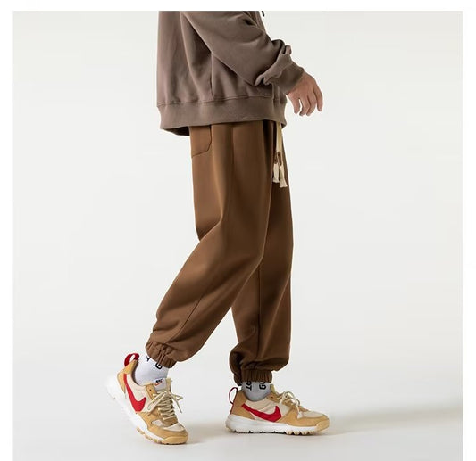 Calças casuais masculinas estilo americano de rua masculina verão soltas de cor sólida calças de moletom de marca da moda primavera e outono para esportes pesados