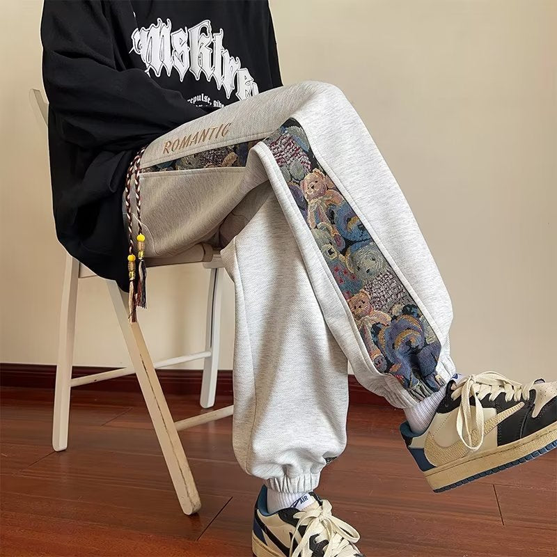 calça masculina larga de perna solta com desenhos estampados