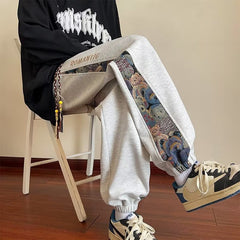calça masculina larga de perna solta com desenhos estampados