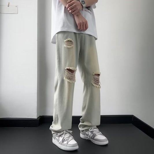 calça jeans masculina com joelhos rasgados