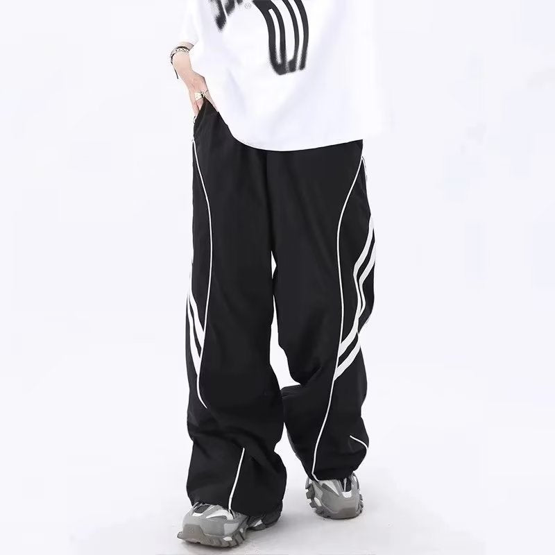 calça larga corta vento estilo streetwear