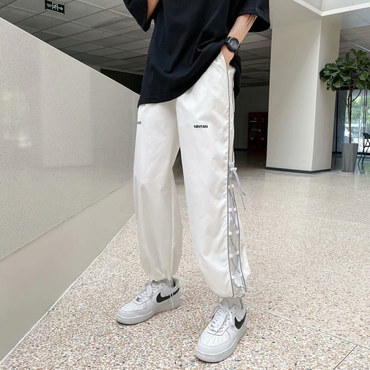 calça masculina estilo high street larga com faixas do lado a prova da agua